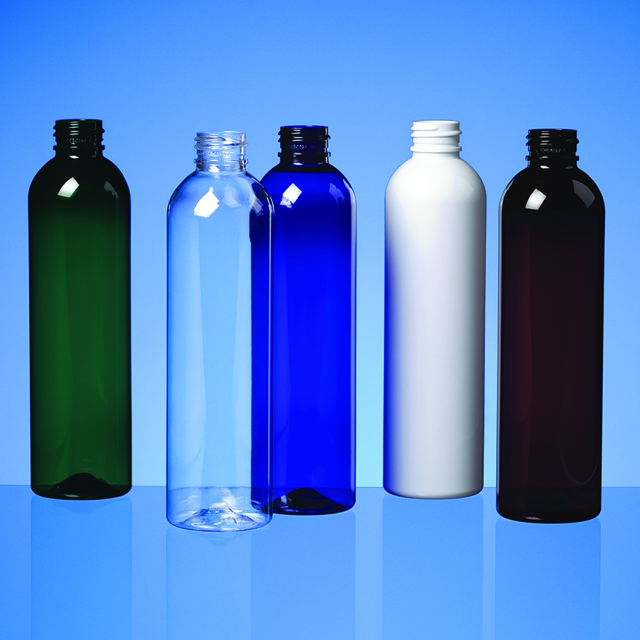 five round taller bottles with sloped shoulders in black, clear, white and amber