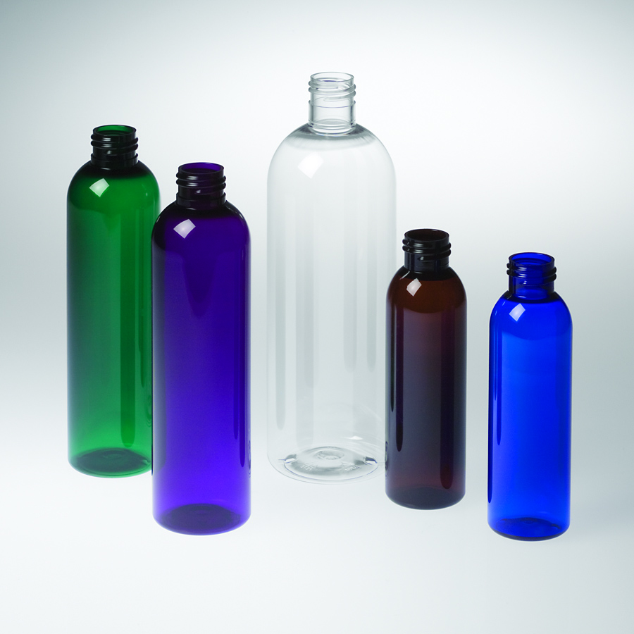 five tall round bottles in green, purple, clear, amber and cobalt blue, shown in multiple sizes