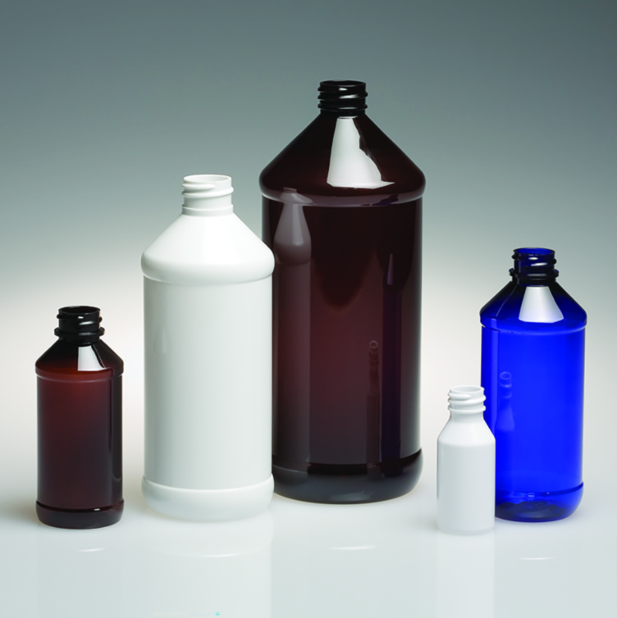 Four bottles with indented panel areas in amber, white and cobalt blue, shown in multiple sizes