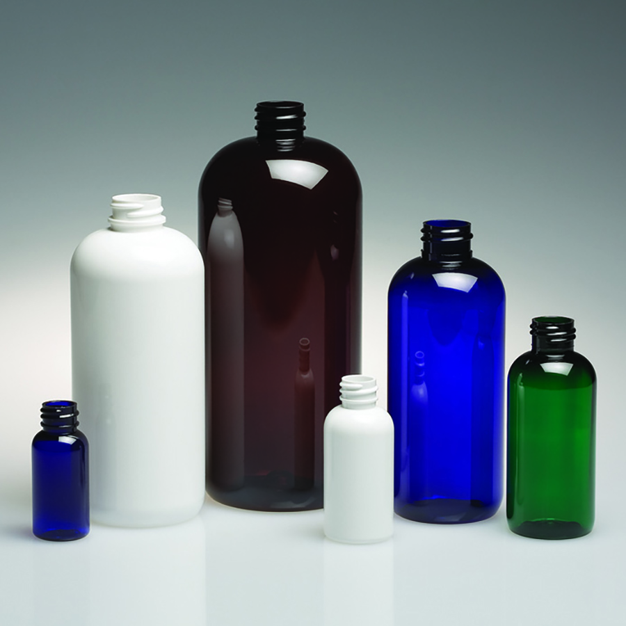 six traditional height boston round bottles in cobalt blue, amber, white, and green, shown in multiple sizes