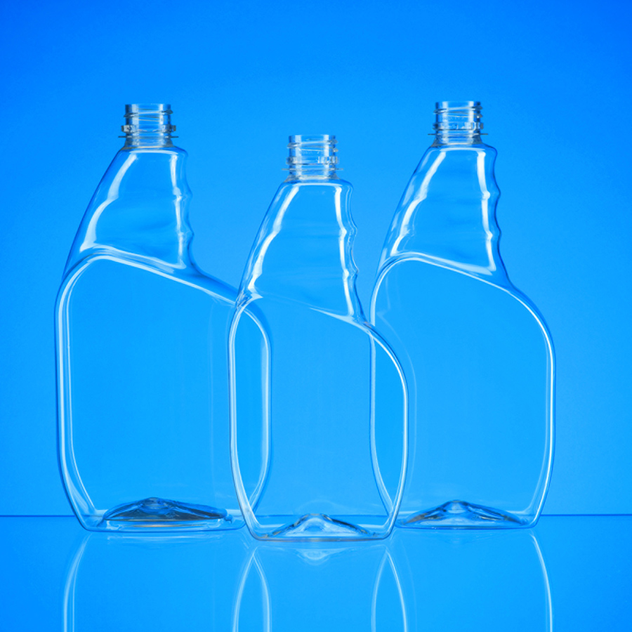 3 clear plastic bottles in oval shape with offset neck area to hold bottle while spraying