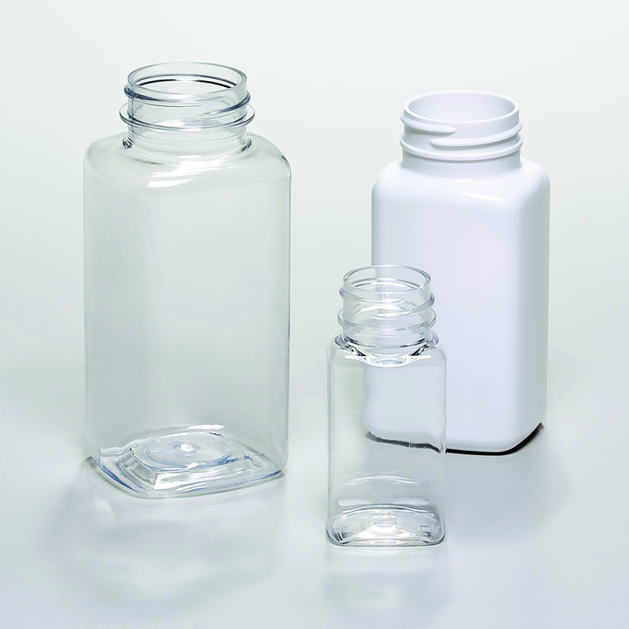 3 plastic oblong shaped bottles or jars in clear and white plastic