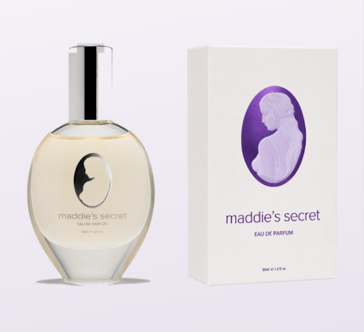 White box with shiny purple hot stamping and Clear glass bottle of perfume with a shiny silver label and shiny silver cap.